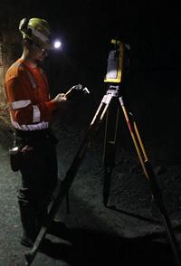 Surveyor working with equipment graphic.